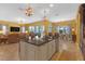 Open-concept kitchen boasts a center island, granite countertops, and seamless flow to living area at 8414 Eagle Brook Dr, Land O Lakes, FL 34638