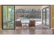 View of a private lanai featuring a screened in pool, outdoor furniture, and wooded views at 8414 Eagle Brook Dr, Land O Lakes, FL 34638