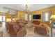 Inviting living room with elegant furnishings, chandelier, and staircase leading to the upper level, perfect for Gathering gatherings at 8414 Eagle Brook Dr, Land O Lakes, FL 34638