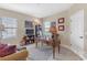 Charming home office with a classic wooden desk, chair, and ample shelving for storage at 8414 Eagle Brook Dr, Land O Lakes, FL 34638