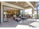 Covered patio with outdoor seating area and interior view at 8414 Eagle Brook Dr, Land O Lakes, FL 34638