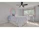 Bedroom featuring a rainbow wall design, ceiling fan, and natural light at 872 Live Oak Ne Ter, St Petersburg, FL 33703