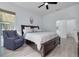 Primary bedroom with a plush king bed and light-filled windows at 872 Live Oak Ne Ter, St Petersburg, FL 33703