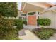 Home entrance with decorative front doors and manicured landscaping at 872 Live Oak Ne Ter, St Petersburg, FL 33703