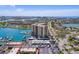 An aerial view features a coastal community near a large body of water at 10355 Paradise Blvd # 909, Treasure Island, FL 33706