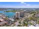 This aerial photo captures a high-rise building on a sunny day at 10355 Paradise Blvd # 909, Treasure Island, FL 33706