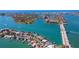 Birds eye view of a waterfront community with bridges and boating at 10355 Paradise Blvd # 909, Treasure Island, FL 33706