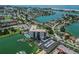 Aerial view of the condo and community with easy access to boat slips, parking, and a community pool at 10355 Paradise Blvd # 909, Treasure Island, FL 33706