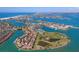 An expansive aerial view showcases a coastal community with waterways at 10355 Paradise Blvd # 909, Treasure Island, FL 33706