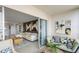 Relaxing balcony with comfortable furniture and sliding glass doors at 10355 Paradise Blvd # 909, Treasure Island, FL 33706