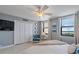 Bedroom featuring a large window, art, and closet at 10355 Paradise Blvd # 909, Treasure Island, FL 33706