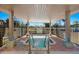 Hot tub under a gazebo with a metal fence at 10355 Paradise Blvd # 909, Treasure Island, FL 33706