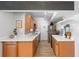 Galley kitchen featuring stainless steel appliances and quartz countertops at 10355 Paradise Blvd # 909, Treasure Island, FL 33706