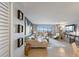 Open concept living room with a large window overlooking the marina at 10355 Paradise Blvd # 909, Treasure Island, FL 33706