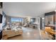 Spacious living room featuring a large couch and view of the marina at 10355 Paradise Blvd # 909, Treasure Island, FL 33706