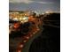 Night view of the city and beach walking path with illuminated lights along the Treasure Island beach at 10355 Paradise Blvd # 909, Treasure Island, FL 33706
