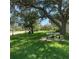 A peaceful park offers shaded benches and well-manicured green spaces at 10355 Paradise Blvd # 909, Treasure Island, FL 33706