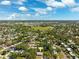 Wide aerial shot of a neighborhood filled with mature trees and beautiful homes at 1119 77Th N St, St Petersburg, FL 33710