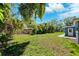 A lush backyard offers privacy with its mature, natural landscaping at 1119 77Th N St, St Petersburg, FL 33710