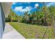 Lush backyard with partial concrete patio at 1119 77Th N St, St Petersburg, FL 33710