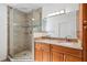 Bathroom featuring glass shower, double vanity and granite countertops at 1119 77Th N St, St Petersburg, FL 33710