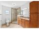 Bathroom featuring a glass shower, double vanity and granite countertops at 1119 77Th N St, St Petersburg, FL 33710