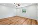 Bright bedroom with wood-look flooring, ceiling fan, and natural light at 1119 77Th N St, St Petersburg, FL 33710