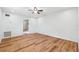 Bright bedroom featuring wood-look flooring, ceiling fan, and neutral walls at 1119 77Th N St, St Petersburg, FL 33710