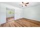 This bedroom has wood floors, fresh paint, and a mirrored closet at 1119 77Th N St, St Petersburg, FL 33710