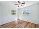Bedroom featuring wood-look flooring, neutral walls and multiple windows at 1119 77Th N St, St Petersburg, FL 33710