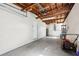 Spacious garage with exposed beam ceiling and utility connections at 1119 77Th N St, St Petersburg, FL 33710