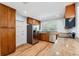 Well-appointed kitchen with stainless steel appliances, wood cabinets, and granite countertops at 1119 77Th N St, St Petersburg, FL 33710