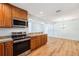 Modern kitchen with stainless steel appliances, granite countertops, and ample storage at 1119 77Th N St, St Petersburg, FL 33710