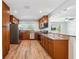 Well-equipped kitchen featuring stainless steel appliances, granite counters, and wood cabinets at 1119 77Th N St, St Petersburg, FL 33710