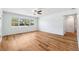 Bright living room features wood-look flooring and large windows with a front yard view at 1119 77Th N St, St Petersburg, FL 33710
