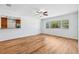 Inviting living space with wood-look floors and a view to the breakfast bar and front yard at 1119 77Th N St, St Petersburg, FL 33710