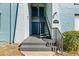 Exterior building entrance with stairs leading to upper-level units at 11407 3Rd N St # 1, St Petersburg, FL 33716