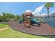 Community playground featuring slides and climbing structure on a mulch surface at 11407 3Rd N St # 1, St Petersburg, FL 33716