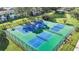 Aerial view of community tennis courts, perfect for recreation and exercise at 11407 3Rd N St # 1, St Petersburg, FL 33716