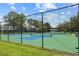 Fenced tennis courts offer residents a convenient recreational amenity at 11407 3Rd N St # 1, St Petersburg, FL 33716