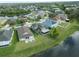 Aerial view of the home showcasing its location on a lot with a scenic water view at 11517 Weston Course Loop, Riverview, FL 33579
