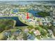 Expansive aerial view showcasing the waterfront property in a desirable community with scenic lakes and lush landscaping at 11517 Weston Course Loop, Riverview, FL 33579