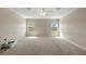 Large bonus room with carpet, two windows, and neutral paint at 11517 Weston Course Loop, Riverview, FL 33579