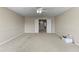 Spacious carpeted bonus room with double doors and neutral walls at 11517 Weston Course Loop, Riverview, FL 33579