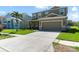 Charming two-story home featuring a two-car garage, well-manicured lawn, and inviting curb appeal at 11517 Weston Course Loop, Riverview, FL 33579