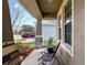 Cozy front porch with seating area, offering a relaxing outdoor space with stone pillar details at 11517 Weston Course Loop, Riverview, FL 33579