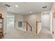 Upstairs hallway with carpet and white wood railing at 11517 Weston Course Loop, Riverview, FL 33579