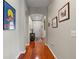 Inviting hallway featuring hardwood floors and decorative archways, leading to the front door at 11517 Weston Course Loop, Riverview, FL 33579