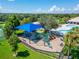 A playground area offers covered play equipment, providing shaded fun for children, located close to other community amenities at 11517 Weston Course Loop, Riverview, FL 33579