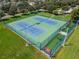 Overhead view of two tennis courts and practice area offer a place to get in a workout close to home at 11517 Weston Course Loop, Riverview, FL 33579
